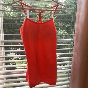 Orange Lululemon racer back workout tank.